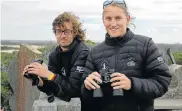  ?? Picture: WERNER HILLS ?? WHALE SPOTTING: Warren Tarboton, left, and Jake Keeton look out for whales from the viewpoint of an old fort at Cape Recife during the Celebratio­n of the Arrival of the Whales in Algoa Bay on Saturday