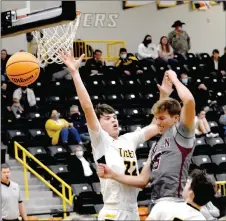  ?? MARK HUMPHREY ENTERPRISE-LEADER ?? Lincoln senior Tyler Brewer draws a foul in the lane from Prairie grove’s Blake Gardner during a nonconfere­nce boys basketball rivalry game against Lincoln on Tuesday, Dec. 8.