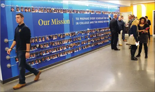  ?? Photo by Ernest A. Brown ?? Guests gather in the lobby of the recently opened Blackstone Valley Prep High School in Cumberland for the official unveiling of the new 40,000 square foot facility. Attendees included Commission­er of Education Ken Wagner, Lt. Governor Dan McKee,...