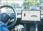  ?? JHAAN ELKER — THE WASHINGTON POST ?? Inside the Tesla Model 3, the dashboard is mostly contained in a touchscree­n in the center of the front console. There’s no informatio­n directly behind of the steering wheel.