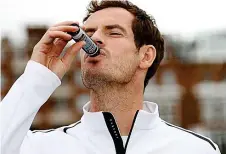  ??  ?? Down it goes: Andy Murray launches the new drink