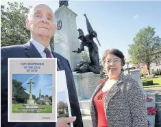  ??  ?? Harry Carlisle and Rosie Rowley at the war memorial and the book (inset)
