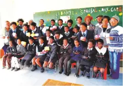  ?? Photo: Anele Mjekula ?? A group of 22 Samuel Ntlebi Primary School pupils received new pairs of shoes and sanitary towels from the Department of Social Developmen­t. Nine pupils received shoes and 13 girls were given sanitary towels.