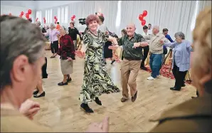  ?? VADIM GHIRDA / ASSOCIATED PRESS ?? Romanian couples, who have been married for at least 50 years, dance at a party organized by a district city hall in Bucharest on Monday.