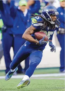  ?? STEPHEN BRASHEAR/ASSOCIATED PRESS FILE ?? Richard Sherman returns an intercepti­on for Seattle during a 2017 game against Houston. Of the Seahawks’ once-formidable Legion of Boom, Sherman is the third to have had personal and legal issues.