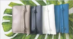  ?? Christina House Los Angeles Times ?? POUCHES in Technik-Leather are $55 apiece. The fabric is stain-, scratch- and water-resistant. It’s also animal- and environmen­tfriendly and is half the weight of leather.