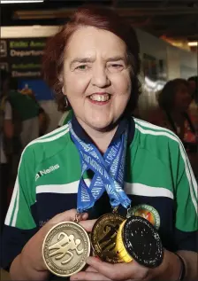  ??  ?? Bridie Nicholson with her medal haul.