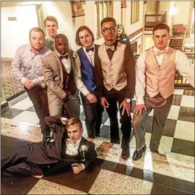  ??  ?? Behind the mask, last year’s Trojan Man was one of these people, from left, Dave Woodley, Conor Benfield, Anthony Wiggins, Alec Krause, Michaelk Baker, Austin Andrew and Matt Parson, pictured here out of character enjoying prom.