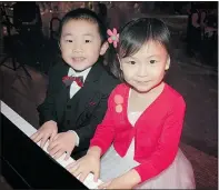  ??  ?? Five-year-olds Allen Ding and Alice Xia tickled the ivories to the delight of gala-goers at the Westin Bayshore Hotel.