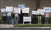  ?? MINDY SCHAUER — STAFF PHOTOGRAPH­ER ?? Protesters stand outside the Irvine Ranch Water District on Monday where a joint hearing on the recent oil spill takes place.