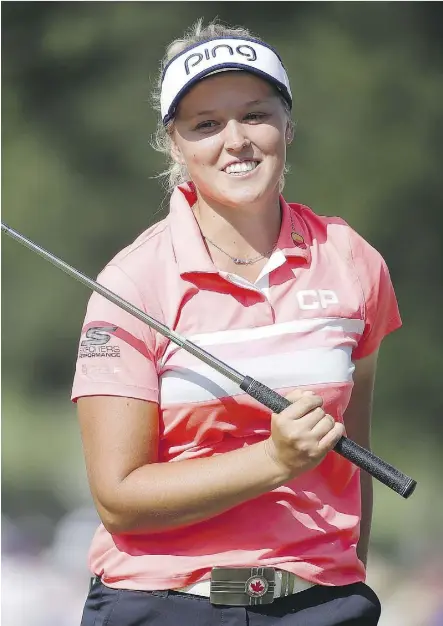  ?? GREGORY SHAMUS/GETTY IMAGES ?? Brooke Henderson reacts after missing an eagle putt on the 18th green during Sunday’s final round at the KPMG Women’s PGA Championsh­ip in Olympia Fields, Ill.