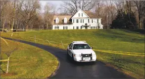  ?? Associated Press file ?? A police cruiser sits in the driveway and crime scene tape surrounds the home of Nancy Lanza at 36 Yoganada St. in Newtown in December 2012.