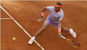  ?? AFP/VNA Photo
rst round ?? CLAY MAN: Rafael Nadal returns the ball to teenager Darwin Blanch during the Spaniard's win in his nal Madrid Open appearance.