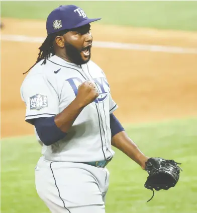  ?? KEVIN JAIRAJ / USA TODAY SPORTS ?? Tampa Bay Rays relief pitcher Diego Castillo celebrates after defeating the Los Angeles Dodgers in Game 2 of the World Series at Globe Life Field. He made short work of the only Dodger he faced, striking him out on three pitches.