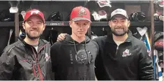  ?? NIAGARA ICEDOGS ?? IceDogs first-round draft pick Isaac Enright, centre, is flanked by GM Joey Burke and head coach Billy Burke following the 2019 draft. Selfies taken by the top picks will replace team photo-ops for the time being.