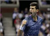  ?? JULIO CORTEZ — ASSOCIATED PRESS ?? Novak Djokovic reacts during his match against Juan Martin del Potro at the U.S. Open in New York on Sunday.