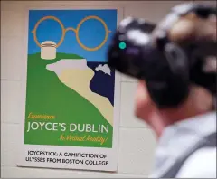  ?? AP PHOTO/CHARLES KRUPA ?? Joseph Nugent, a professor of English at Boston College, wears virtual reality goggles at the school's virtual reality lab in Boston. College students in Boston are developing a virtual reality game based on James Joyce’s ponderous tome “Ulysses.”...