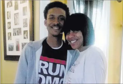 ?? Trina Singleton ?? Trina Singleton and her eldest son, Darryl, at home in Collingdal­e, Pa. Darryl was one of three people killed in shootings on Sept. 13, 2016. Now a new website is working to show that Darryl and victims like him are more than statistics.