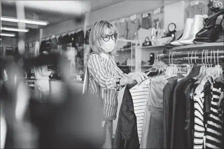  ?? ROZETTE RAGO/THE NEW YORK TIMES ?? Laurie Sigelman browses July 23 at Crossroads Trading, a consignmen­t store in Los Angeles.