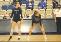  ?? STAFF PHOTO BY TED BLACK ?? Leonardtow­n High School senior Emily Boyd, left, and sophomore Julia Mattingly, await a serve during last Thursday’s 4A state championsh­ip match against Arundel. The Raiders were eventually swept by the Wildcats, 25-21, 25-19, 25-20 in the title match at Harford Community College.