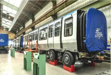  ?? — AFP photo ?? Carriages built by Alstom at the production site for the RER NG rolling stock, a project for which the National Society of French Railways (SNCF) had issued a call for tenders in 2013 on behalf of the Transport Union for the Ile-de-France (STIF), in Petite-Forêt near Valencienn­es, northern France.