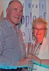  ??  ?? Joe Healy presents an award to joint-Community Support Person of the Year, Eileen Earls.