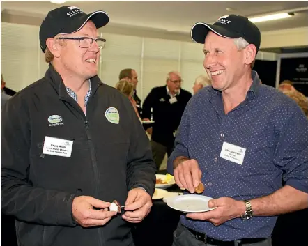  ??  ?? Southland Deer Farmers Associatio­n chairman Bruce Allan, left, and New Zealand Deer Farmers Associatio­n chairman John Somerville enjoy some venison at the opening of Alliance’s new venison plant at Lorneville. PHOTO DIANE BISHOP