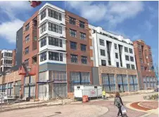  ??  ?? The Synergy project is bringing two six-story apartment and retail buildings to The Mayfair Collection mixed-use developmen­t, in Wauwatosa.