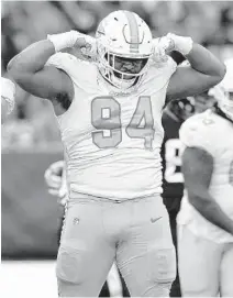  ?? STEVE LUCIANO/AP ?? Dolphins defensive end Christian Wilkins celebrates after a play against the Jaguars at Tottenham Hotspur Stadium in London.