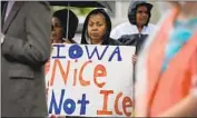  ?? Charlie Neibergall Associated Press ?? A RALLY by a migrant rights group that is among those joining the federal lawsuit against Iowa.