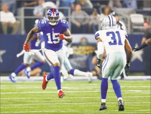  ?? Roger Steinman / Associated Press ?? Giants wide receiver Brandon Marshall runs a route as Cowboys safety Byron Jones defends during a Sept. 10 game in Arlington, Texas.