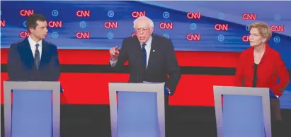  ?? (Lucas Jackson/Reuters) ?? US SENATOR Bernie Sanders speaks as South Bend Mayor Pete Buttigieg and US Senator Elizabeth Warren listen on the first night of the second 2020 Democratic US presidenti­al debate in Detroit, Michigan, Tuesday night.