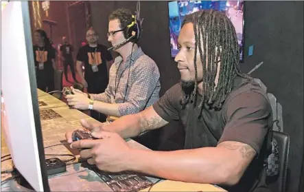  ?? Charley Gallay Getty Images for Activision ?? TODD GURLEY of the Rams is one of many NFL players who spend free time playing video games against teammates and even fans.