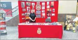  ?? SUBMITTED/SJRFD PHOTO ?? An informatio­n booth with be set up at the Avalon Mall next week to help promote Fire Prevention Week. Insp. Cara Pardy, of the fire prevention division of the St. John’s Regional Fire Department was on hand last year to answer any and all inquiries.