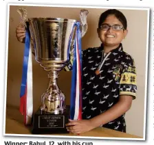  ??  ?? Winner: Rahul, 12, with his cup