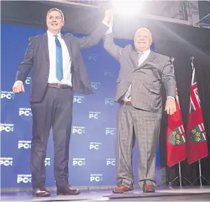  ?? CHRIS YOUNG THE CANADIAN PRESS ?? Andrew Scheer and Doug Ford both spoke out against the federal carbon tax at the PC convention.