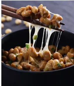  ??  ?? Natto is fermented soybeans, which include the nattokinas­e enzyme that seems to have a hypotensiv­e effect. SHUTTERSTO­CK