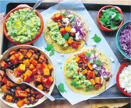  ?? ERIC AKIS ?? These meat-free tacos feature B.C. squash, corn, cherry tomatoes, cabbage and cheese.