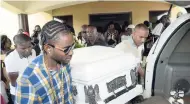  ??  ?? Pall bearers (from left) Akeem Rhaman, Orlando Blake (Frankie Paul’s son), Patrick Lennon (Frankie Paul’s brother), Trevor Francis and Nick Martin carry the casket containing the body of late recording artiste Paul ‘Frankie Paul’ Blake from Olson...