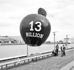  ??  ?? A balloon depicting Apple inc, is tethered before a protest against household water charges, by demonstrat­ors urging the Irish Government to accept the European Commission’s Apple tax ruling of 13 billion euros (US$14.6 billion) in back taxes, in Dublin, Ireland. — Reuters photo