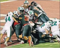  ?? [BRYAN TERRY/ THE OKLAHOMAN] ?? Del City's Quinlan Ganther leaps for a touchdown to put Del City up 20-17 in the final seconds of Friday's game in Del City.