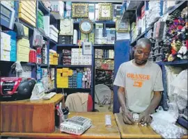  ?? Anna Pujol-Mazzini For The Times ?? MOST MALIANS who can’t read or write find the web of little use, but Lenali, a phone-to-web app, is drawing users. Above, a shop in Bamako’s Dabanani market.