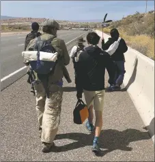  ?? COURTESY PHOTO ?? Below: A group of Rio Grande Water Walk and Global Peace Walk participan­ts approach Pojoaque on Sunday (April 10). Ultimately headed for Creede, Colo., the annual event’s Taos County leg will feature an Indigenous-led prayer run that starts in Velarde on Saturday morning.