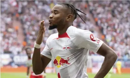  ?? ?? Christophe­r Nkunku celebrates after scoring for Leipzig against Wolfsburg last month. Photograph: Sebastian Kahnert/AP