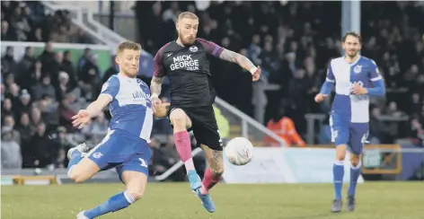  ??  ?? Marcus Maddison (black shirt) in action for Posh.