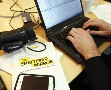  ?? FRED CHARTRAND/THE CANADIAN PRESS ?? A reporter works on his story after Edward Greenspon, president and chief executive officer of the Public Policy Forum, held a news conference to release his report The Shattered Mirror in January.