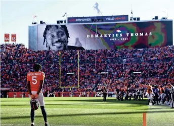  ?? GETTY IMAGES ?? Denver quarterbac­k Teddy Bridgewate­r looks on during the tribute to the late former Broncos player Demaryius Thomas before Sunday’s game.