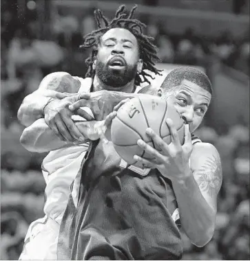  ?? Wally Skalij Los Angeles Times ?? CLIPPERS CENTER DeAndre Jordan can’t reach the ball and grabs Derrick Favors’ arm instead as they battle for a rebound. Jordan, who led the Clippers with 24 points and 17 rebounds, was called for a foul.