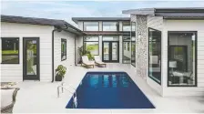  ?? ?? A pool is the centrepiec­e of the home's gorgeous outdoor entertainm­ent space. There's also a pool house with a den, pergola and storage space.