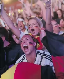  ?? Markus Schreiber/The Associated Press ?? German soccer fans celebrate after their team defeated host Brazil 7-1 in World Cup semifinal action Tuesday in Belo Horizonte.